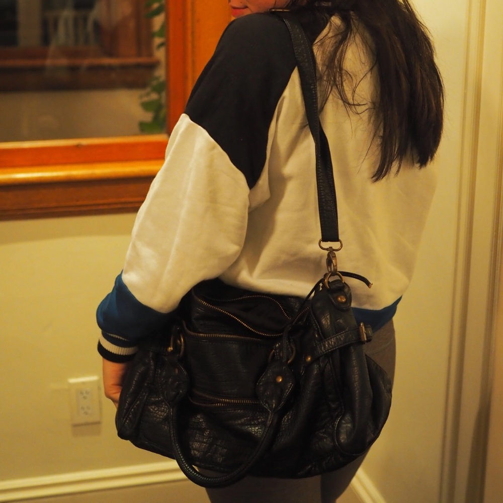 Black, faux-leather slouchy purse.